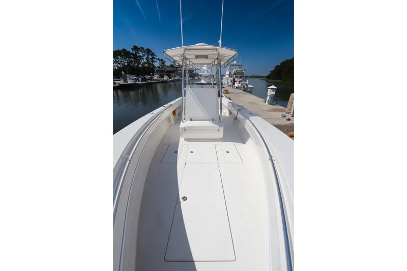 Slide: The Image of 2008 Contender 31 Tournament boat docked at marina under clear blue sky. - 12
