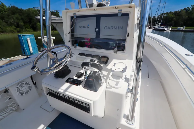 Slide: The Image of 2008 Contender 31 Tournament boat dashboard with Garmin navigation system and steering wheel. - 16