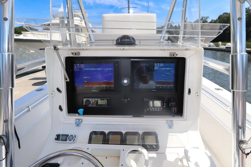 Slide: The Image of 2008 Contender 31 Tournament boat dashboard with navigation and communication equipment. - 18