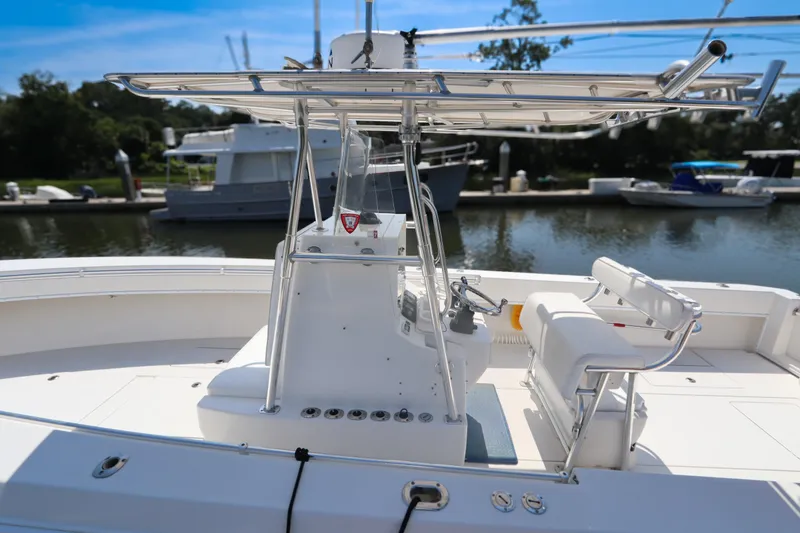 Slide: The Image of 2008 Contender 31 Tournament boat docked, featuring sleek design and spacious deck. - 2