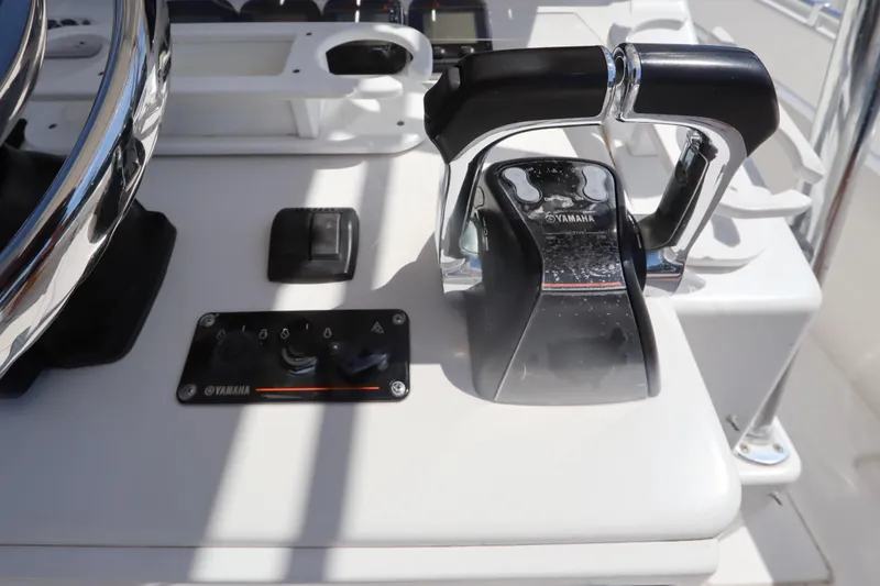 Slide: The Image of Yamaha throttle controls on 2008 Contender 31 Tournament boat dashboard. - 22