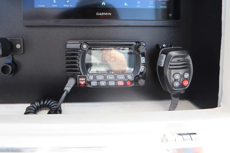 Slide: The Image of 2008 Contender 31 Tournament boat console with Garmin display and Standard Horizon radio. - 23