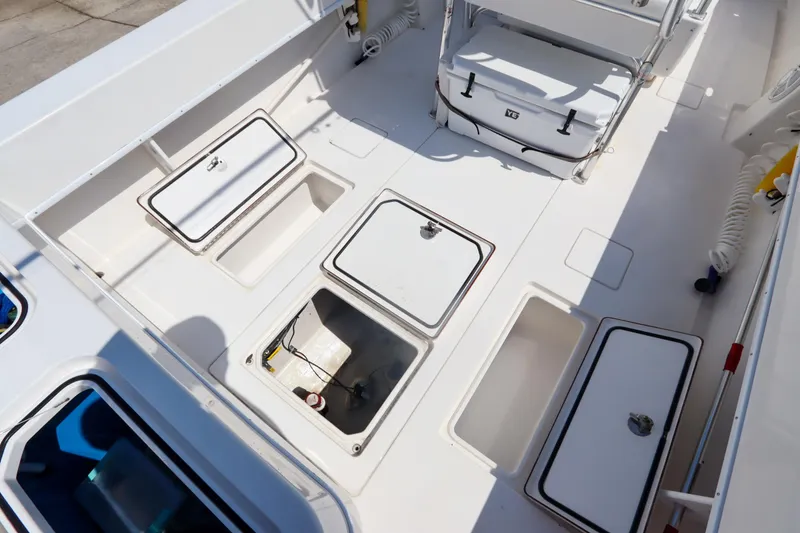 Slide: The Image of 2008 Contender 31 Tournament boat deck with storage compartments and cooler. - 26