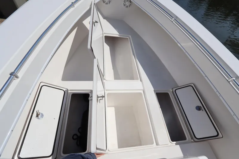 Slide: The Image of 2008 Contender 31 Tournament boat storage compartments open on deck. - 27
