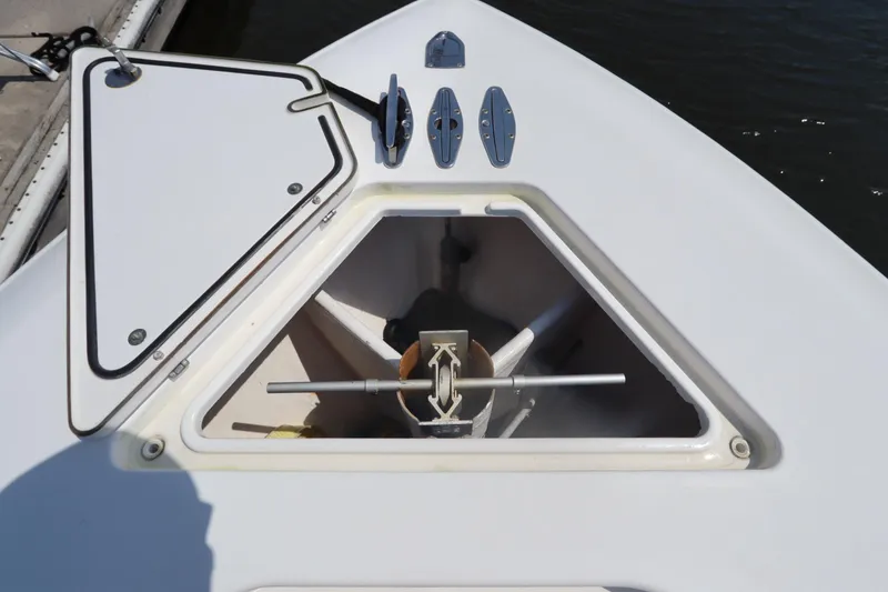 Slide: The Image of Open anchor hatch on 2008 Contender 31 Tournament boat, showing anchor storage. - 29