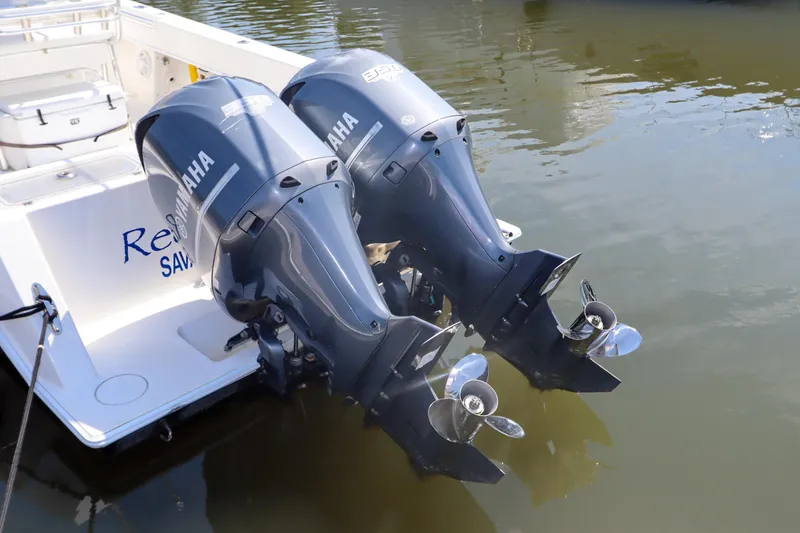 Slide: The Image of 2008 Contender 31 Tournament boat with dual Yamaha outboard engines on water. - 30