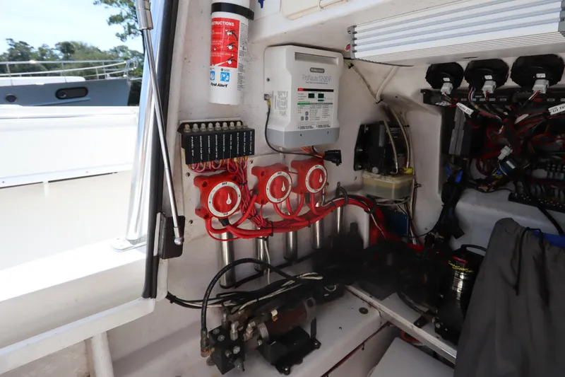 Slide: The Image of Electrical system of a 2008 Contender 31 Tournament boat, featuring wiring and control panels. - 32