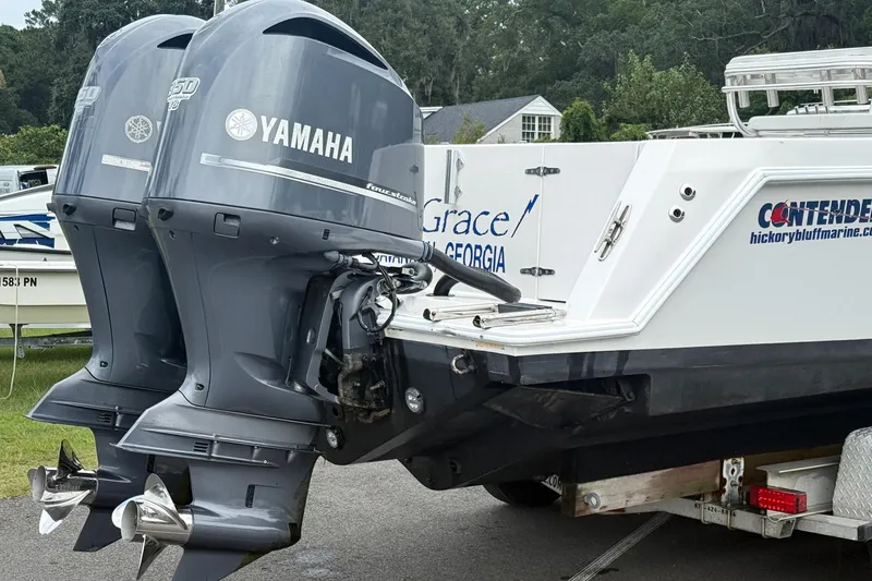 Slide: The Image of 2008 Contender 31 Tournament boat with dual Yamaha outboard motors on a trailer. - 35