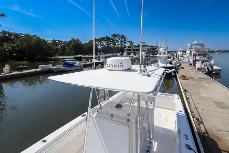 Slide: The Image of 2008 Contender 31 Tournament boat docked with Garmin equipment, clear blue sky. - 4