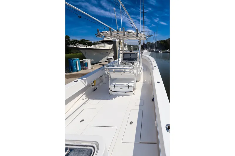 Slide: The Image of 2008 Contender 31 Tournament boat docked, showcasing spacious deck and modern equipment. - 6