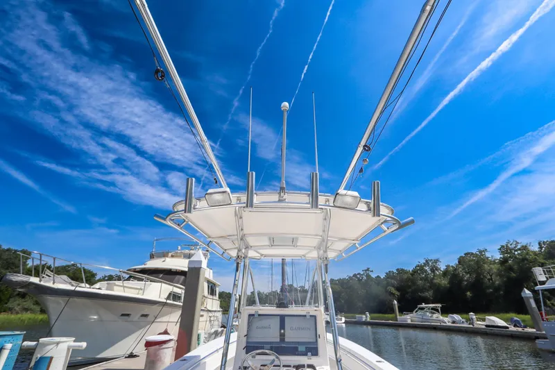 Slide: The Image of 2008 Contender 31 Tournament boat docked under clear blue sky. - 8
