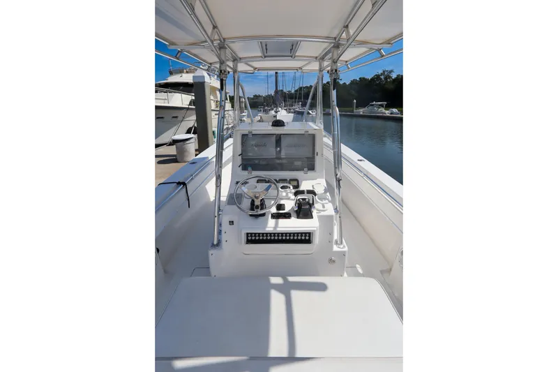 Slide: The Image of 2008 Contender 31 Tournament boat cockpit with steering wheel and navigation equipment. - 9
