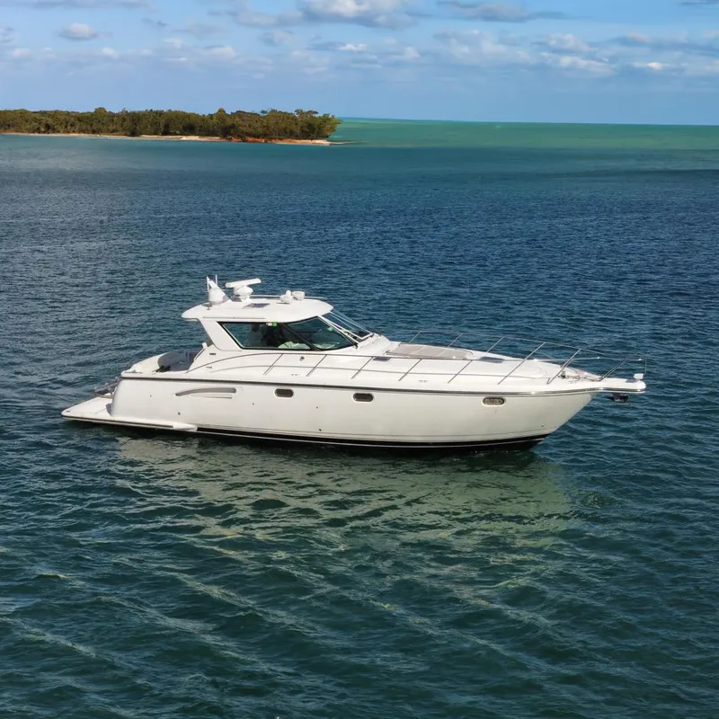 Slide: The Image of 2005 Tiara Yachts 4400 Sovran cruising on open water. - 0