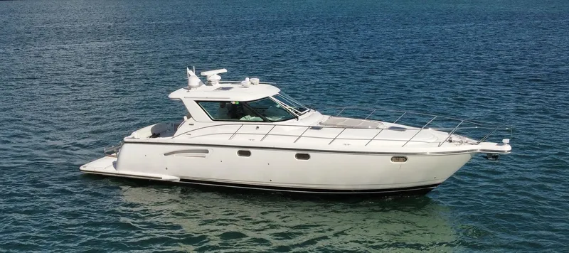 Slide: The Image of 2005 Tiara Yachts 4400 Sovran cruising on open water. - 1