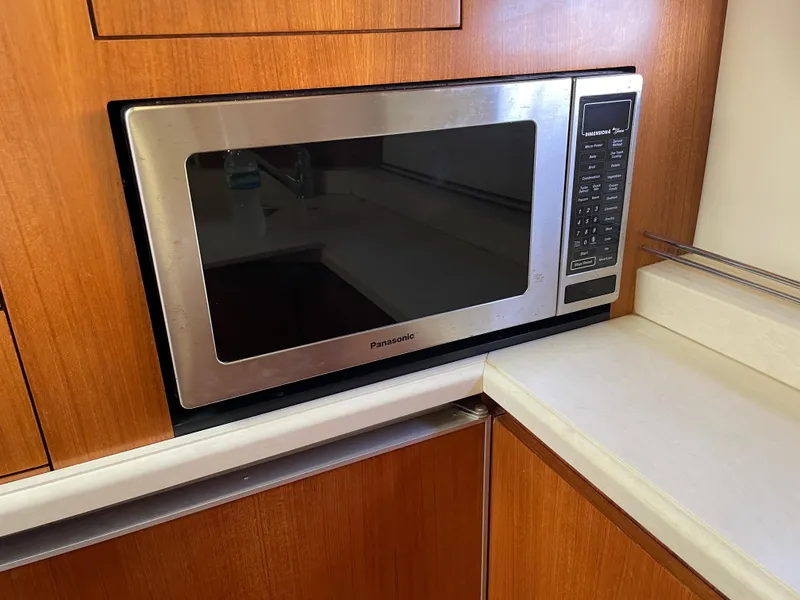 Slide: The Image of Built-in microwave in 2005 Tiara Yachts 4400 Sovran kitchen area. - 12