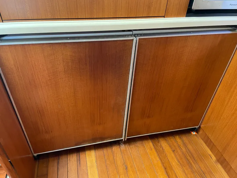 Slide: The Image of Wooden cabinetry in 2005 Tiara Yachts 4400 Sovran, showcasing elegant interior design. - 16