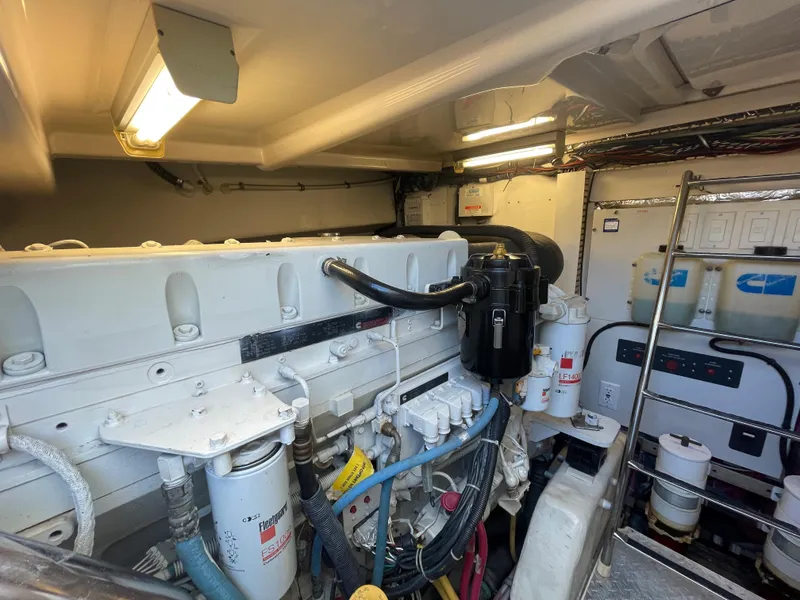 Slide: The Image of Engine room of 2005 Tiara Yachts 4400 Sovran, showcasing mechanical components and wiring. - 17
