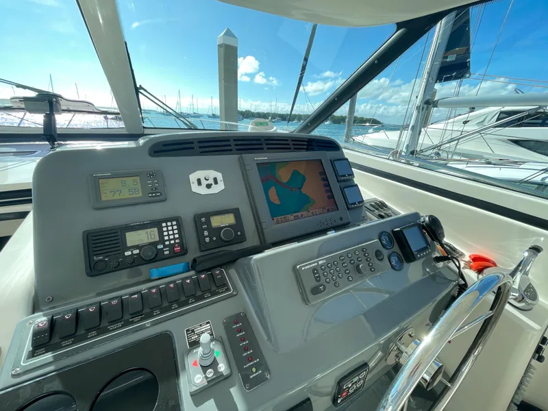 Slide: The Image of Helm of 2005 Tiara Yachts 4400 Sovran with navigation equipment and controls. - 7