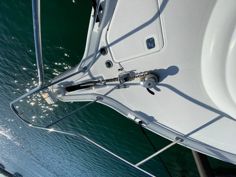 Slide: The Image of 2005 Tiara Yachts 4400 Sovran deck with anchor chain, on sparkling water. - 8