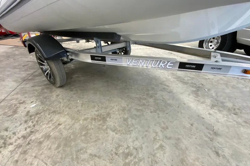 Slide: The Image of Trailer for 2026 Gala A330L boat, featuring Venture branding and sleek design. - 13
