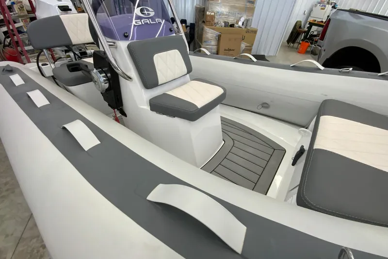 Slide: The Image of Interior of 2026 Gala A330L boat with gray and white seating and modern design. - 14