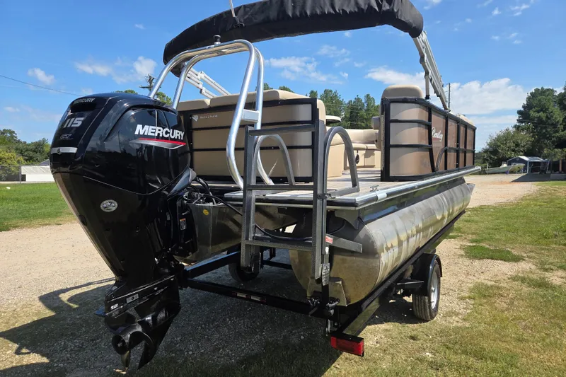 Slide: The Image of 2023 Bentley Pontoons Legacy Cruise with Mercury outboard motor on a trailer. - 4