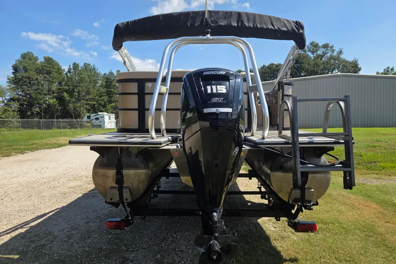 Slide: The Image of 2023 Bentley Pontoons Legacy Cruise with Mercury 115 engine, parked outdoors. - 5