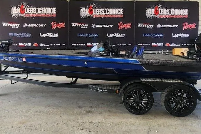 Slide: The Image of 2021 Blazer 650 Pro Tour boat interior with dual seats and advanced dashboard controls. - 4