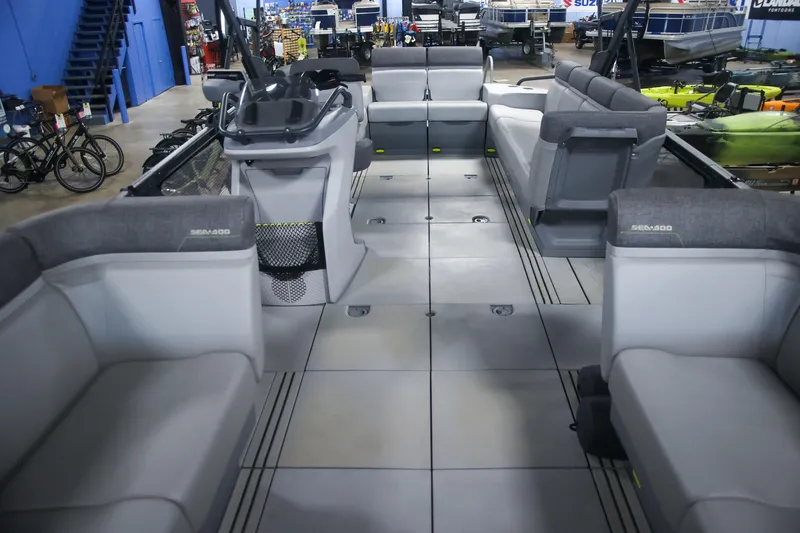 Slide: The Image of 2022 Sea Doo Switch interior with spacious seating and modern design in showroom. - 10