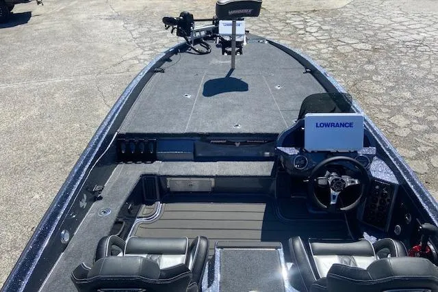 Slide: The Image of 2026 Phoenix 921 ELITE boat interior with Lowrance electronics and dual seating. - 2