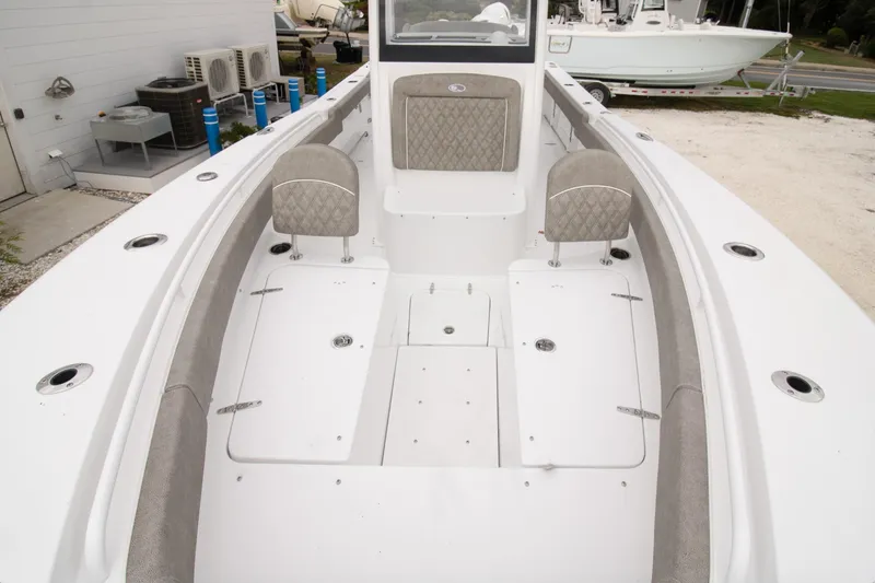 Slide: The Image of 2026 Sea Hunt Gamefish 25 boat interior with seating and storage compartments. - 2