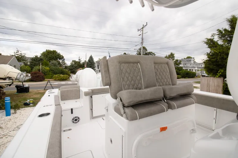 Slide: The Image of 2026 Sea Hunt Gamefish 25 boat interior with cushioned seating and modern design. - 7