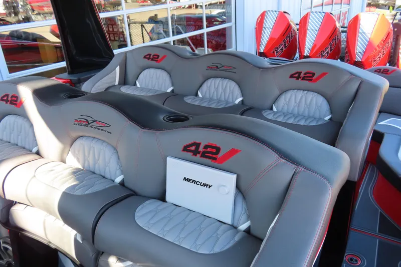 Slide: The Image of Luxury seating on MTI 42 v boat, 2026 model, with Mercury branding and vibrant red accents. - 14
