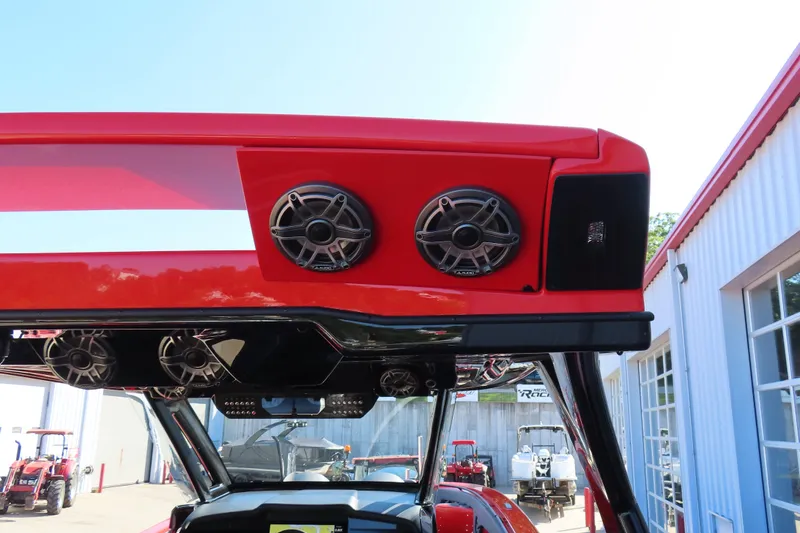 Slide: The Image of Red MTI 42 v boat with speakers, showcasing modern design and audio features, 2026 model. - 22