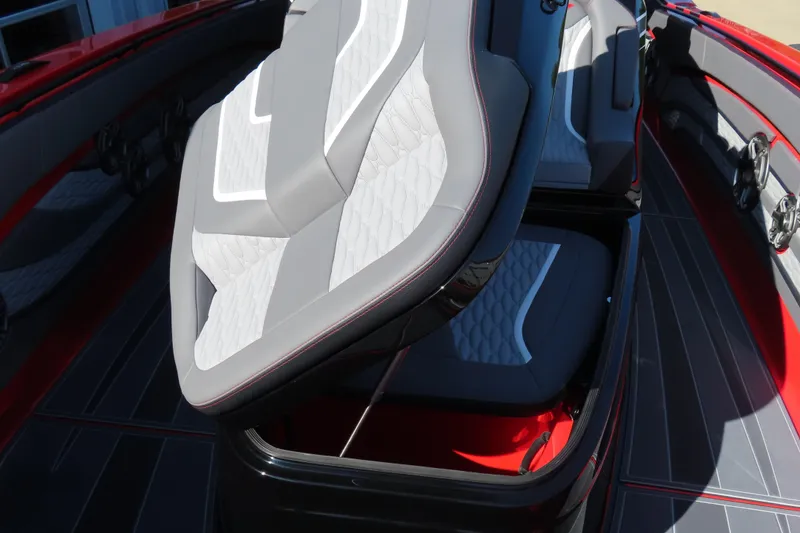 Slide: The Image of 2026 MTI 42 v boat interior with sleek, modern seating and storage compartment. - 24