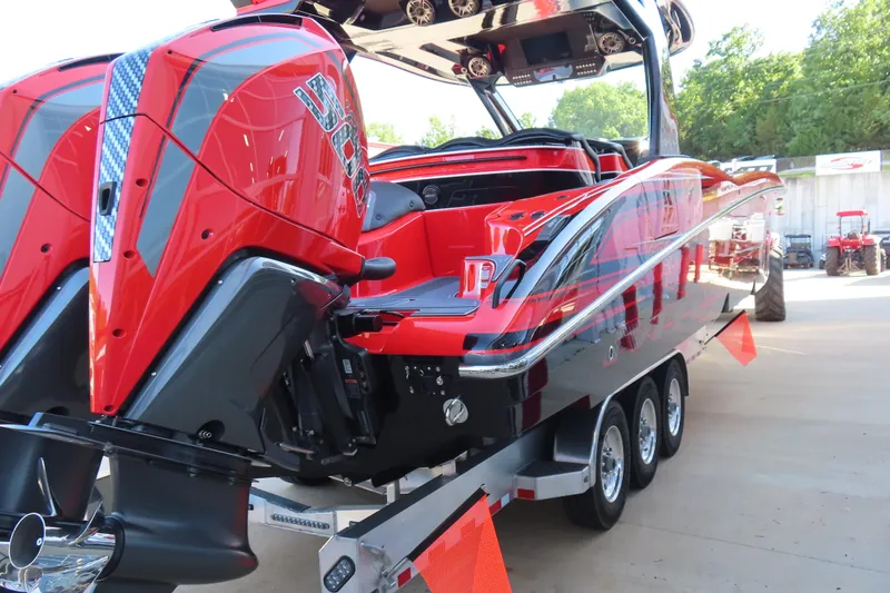 Slide: The Image of Red and black MTI 42 v boat on trailer, 2026 model, with powerful engines. - 4