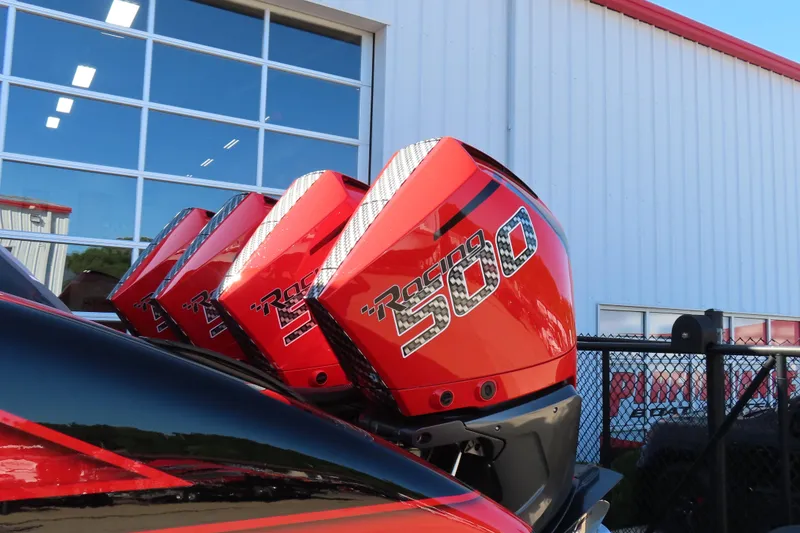 Slide: The Image of Red MTI 42 v boat engines, model year 2026, with "Racing 500" decals. - 6