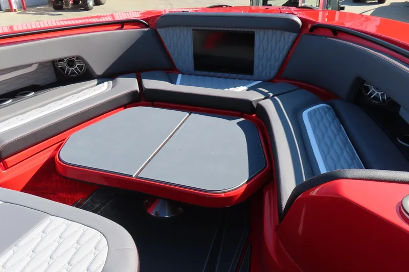 Slide: The Image of Luxurious interior of 2026 MTI 42 v boat with red and gray seating. - 9