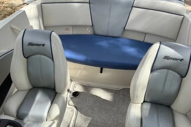 Slide: The Image of Interior of a 2010 Sea Ray 185 Sport boat with cushioned seating. - 5