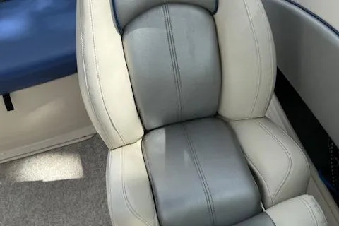 Slide: The Image of 2010 Sea Ray 185 Sport boat seat, gray and white upholstery, close-up view. - 6