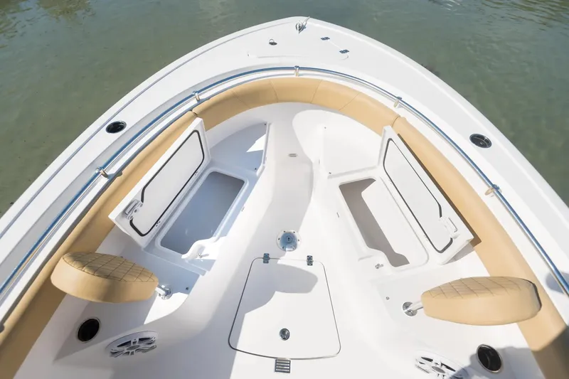 Slide: The Image of 2026 Sportsman Open 232 Center Console boat in showroom, featuring sleek design and modern seating. - 3