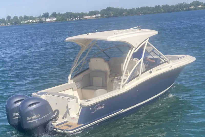 Slide: The Image of 2021 Scout 255 Dorado boat with Yamaha engines on a sunny lake. - 1