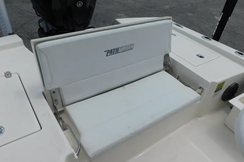 Slide: The Image of 2026 Pathfinder 2200 TRS boat seat, white cushioned, with logo, on deck. - 10