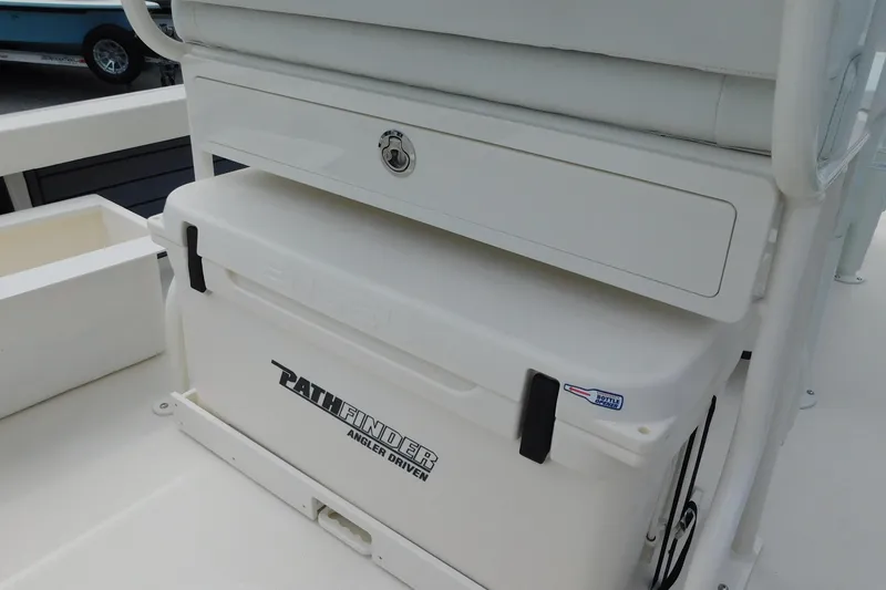Slide: The Image of 2026 Pathfinder 2200 TRS boat with cooler and storage compartment. - 12