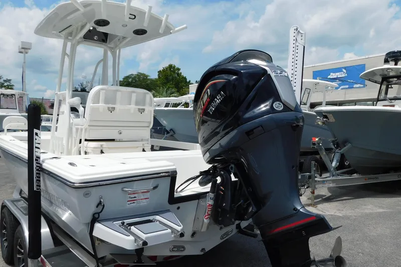 Slide: The Image of 2026 Pathfinder 2200 TRS boat with Yamaha outboard motor, displayed outdoors. - 13