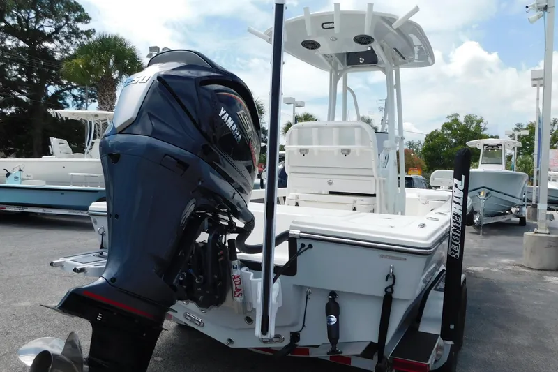 Slide: The Image of 2026 Pathfinder 2200 TRS boat with Yamaha outboard motor, displayed outdoors. - 14