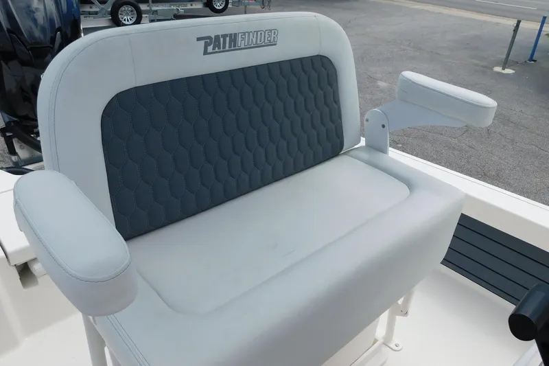 Slide: The Image of 2026 Pathfinder 2200 TRS boat seat with cushioned backrest and armrests. - 17