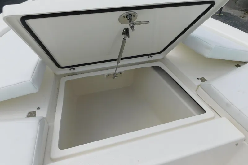 Slide: The Image of Open storage compartment on 2026 Pathfinder 2200 TRS boat, showcasing spacious interior. - 22