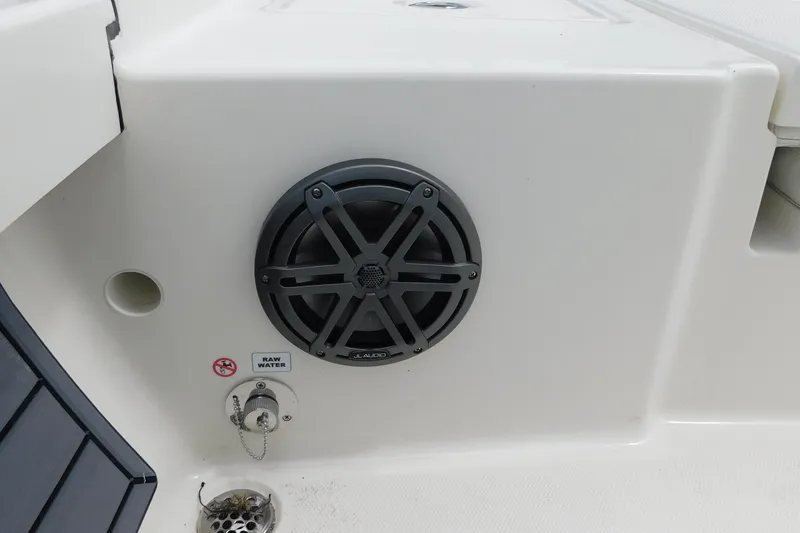 Slide: The Image of Speaker and raw water outlet on 2026 Pathfinder 2200 TRS boat interior. - 30