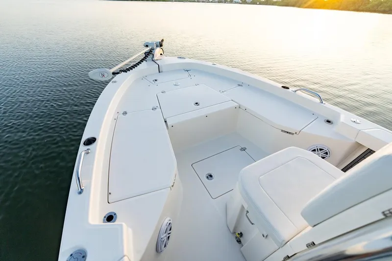 Slide: The Image of 2026 Pathfinder 2200 TRS boat interior on calm water at sunset. - 42